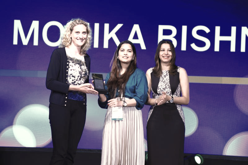 Monika Bishnoi receiving a professional award